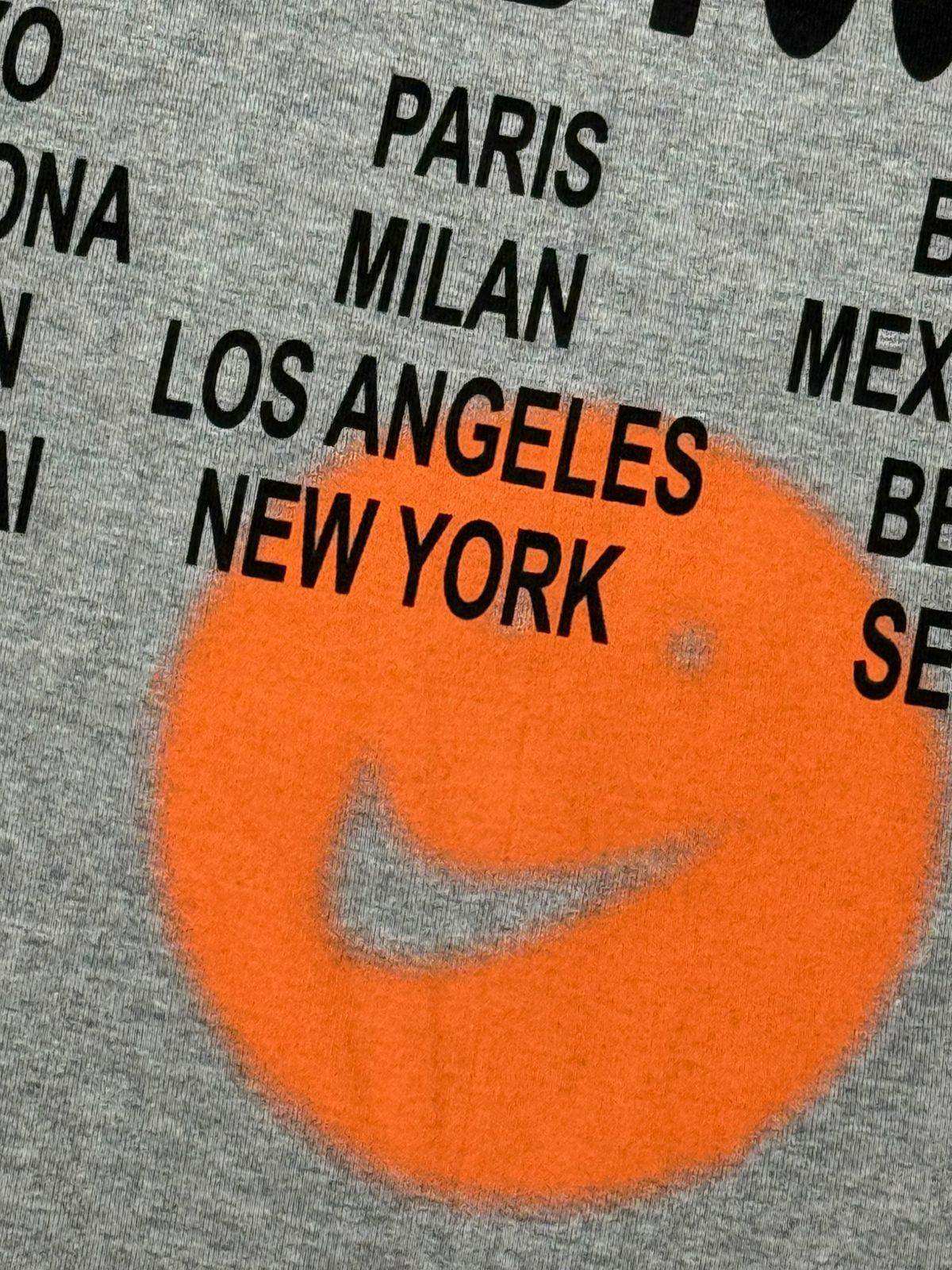 CAMISETA NK WORLD TOUR - CINZA