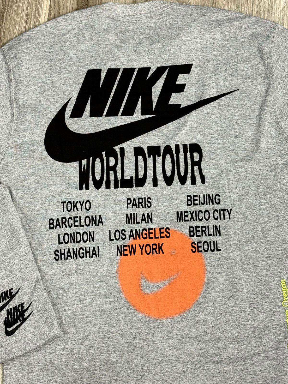 CAMISETA NK WORLD TOUR - CINZA