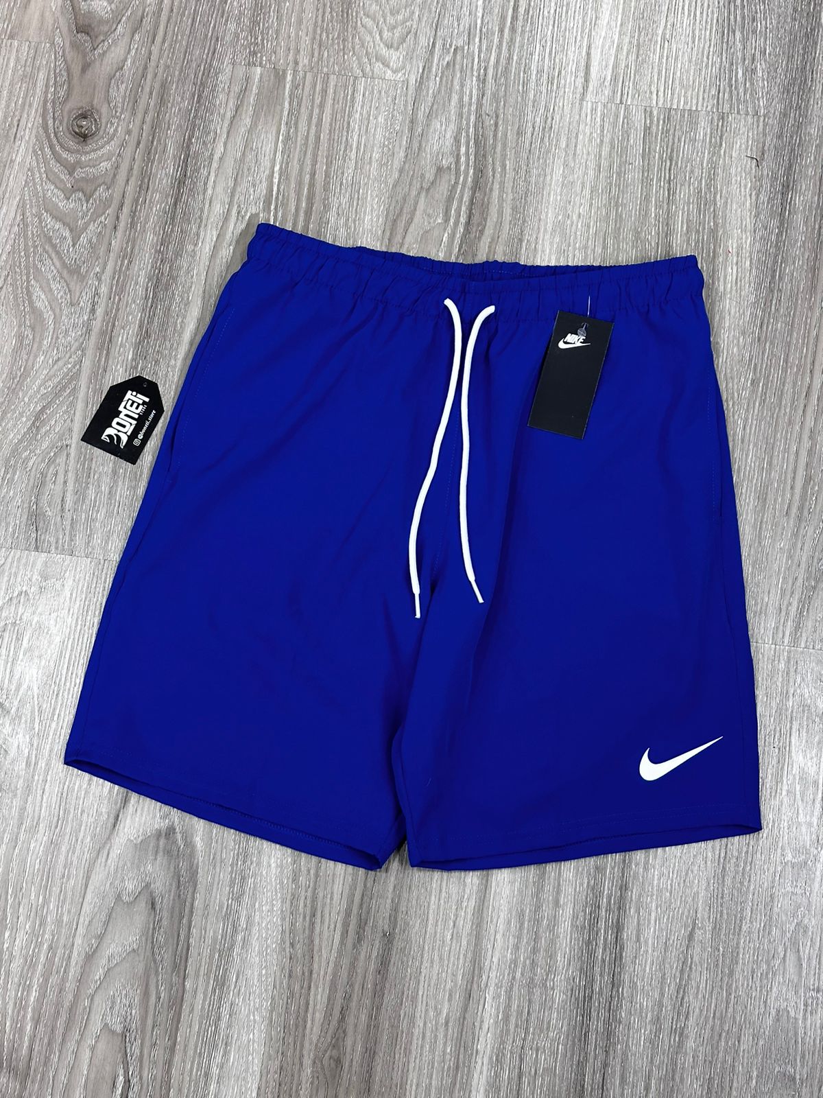 SHORTS TACTEL NK MINI SWOOSH - AZUL