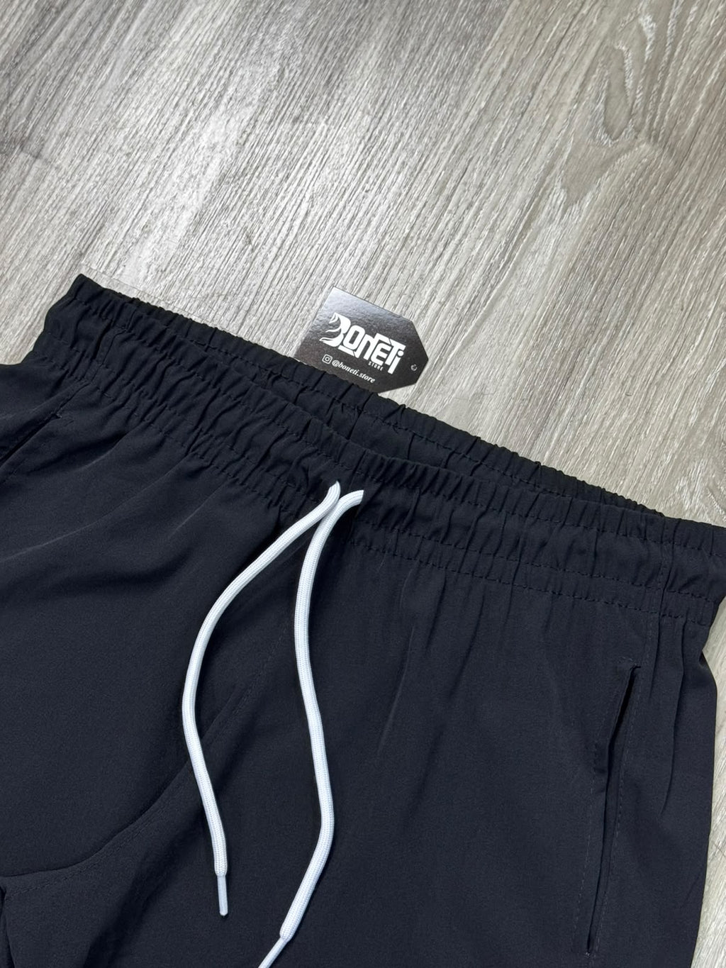 SHORTS TACTEL NK SWOOSH VAZADO VERTICAL - PRETO
